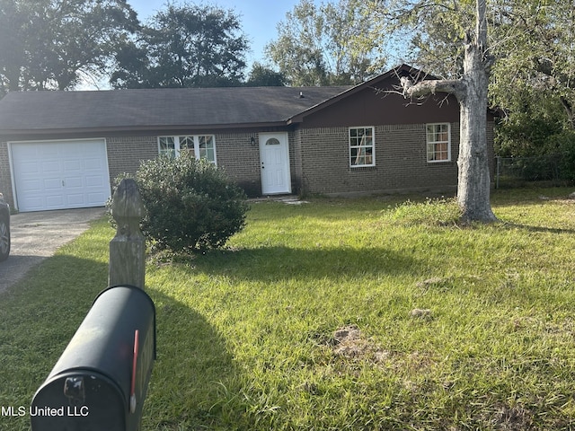 ranch-style home with a garage and a front lawn