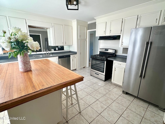 111 Thomas St, Cleveland, MS 38732 - kitchen featuring white cabinetry, dark countertops, stainless steel appliances, and a sink