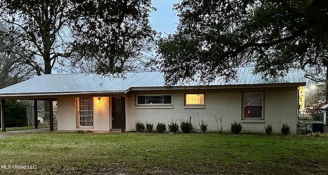 111 Thomas St, Cleveland, MS 38732 - single story home with central AC unit, a carport, a front lawn, and brick siding