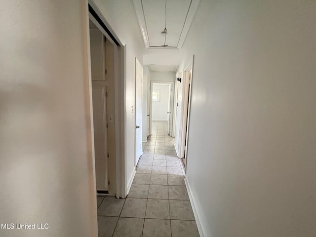 111 Thomas St, Cleveland, MS 38732 - hallway featuring attic access, baseboards, and light tile patterned floors