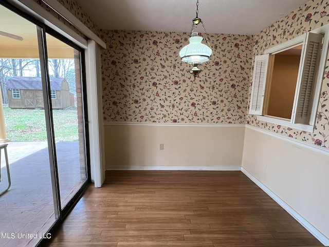 unfurnished dining area with wood-type flooring