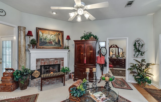 814 Lynwood Ln, Pearl, MS 39208 - living area featuring ceiling fan, a fireplace, wood finished floors, and baseboards