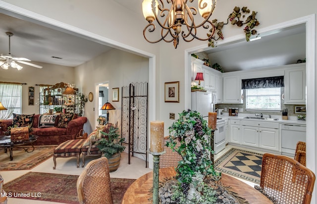 814 Lynwood Ln, Pearl, MS 39208 - kitchen with a sink, white appliances, open floor plan, a ceiling fan, and a chandelier