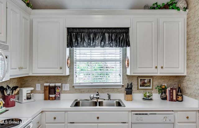 814 Lynwood Ln, Pearl, MS 39208 - kitchen featuring white appliances, a sink, white cabinets, and light countertops
