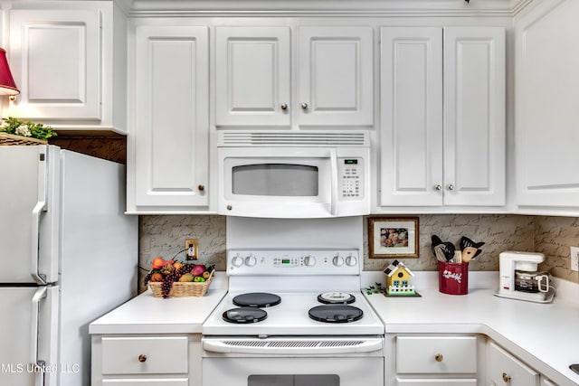 814 Lynwood Ln, Pearl, MS 39208 - kitchen with white appliances, white cabinets, and light countertops