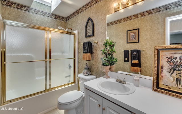 814 Lynwood Ln, Pearl, MS 39208 - full bathroom with vanity, combined bath / shower with glass door, toilet, and tile patterned floors