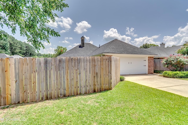 814 Lynwood Ln, Pearl, MS 39208 - view of home's exterior with an attached garage, driveway, and brick siding