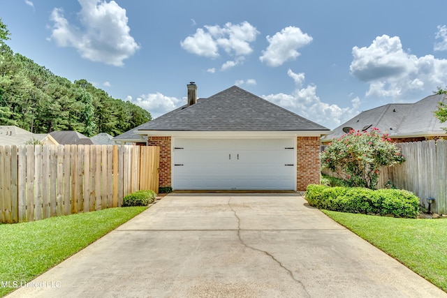 814 Lynwood Ln, Pearl, MS 39208 - view of front facade with brick siding, a shingled roof, and concrete driveway