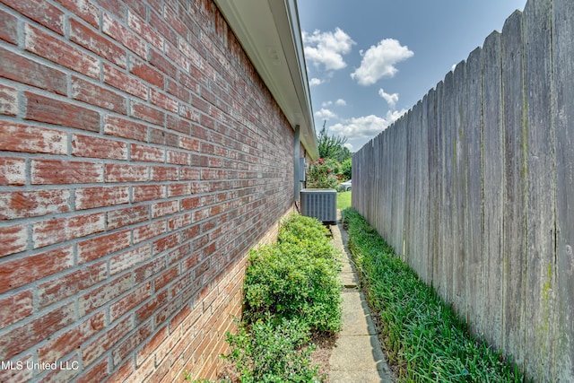 814 Lynwood Ln, Pearl, MS 39208 - view of home's exterior featuring central AC and brick siding