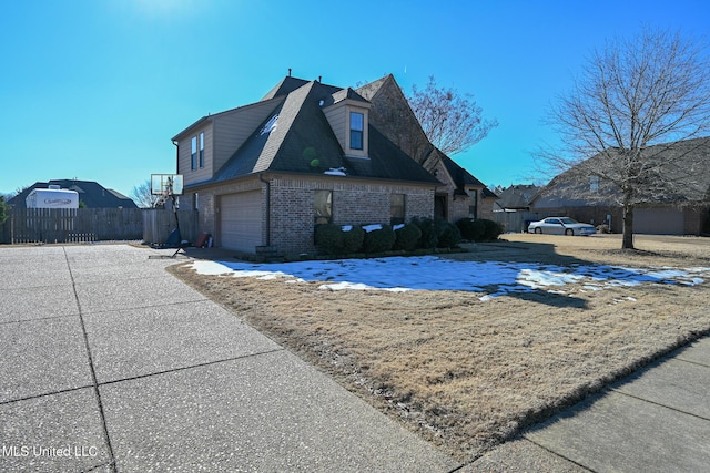 view of side of property featuring a garage