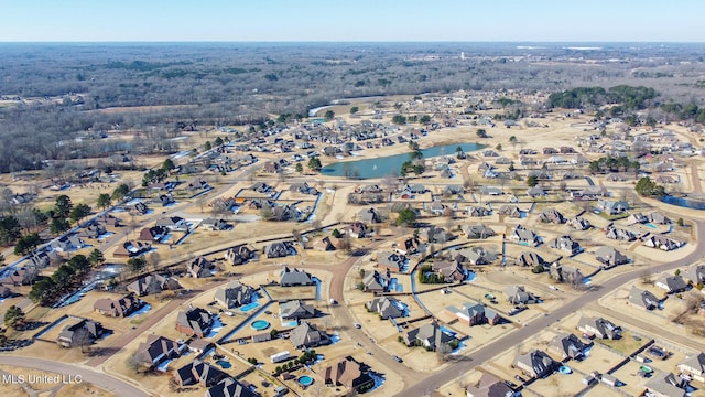 drone / aerial view with a water view