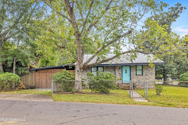 ranch-style home featuring a front yard