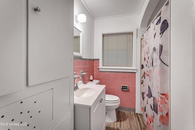 bathroom with wood-type flooring, tile walls, toilet, vanity, and a shower with shower curtain