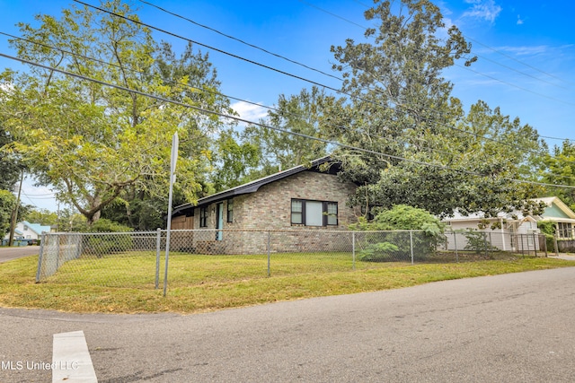 view of home's exterior with a lawn