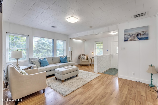 living room featuring light hardwood / wood-style flooring and a wealth of natural light