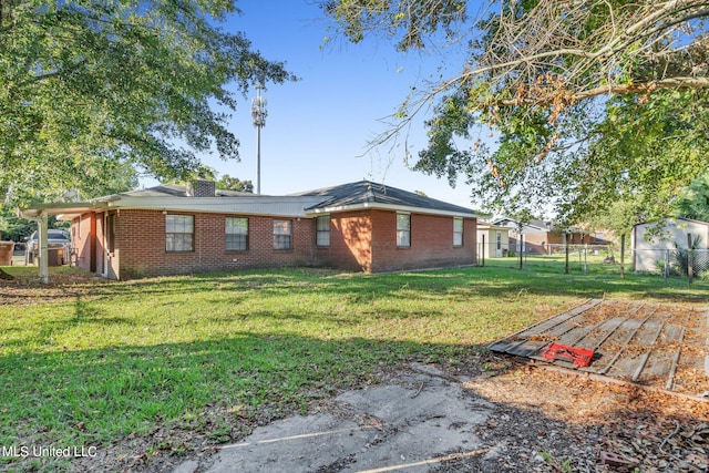 view of side of property with a yard