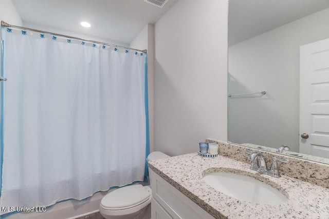 bathroom featuring recessed lighting, vanity, shower / bathtub combination with curtain, and toilet