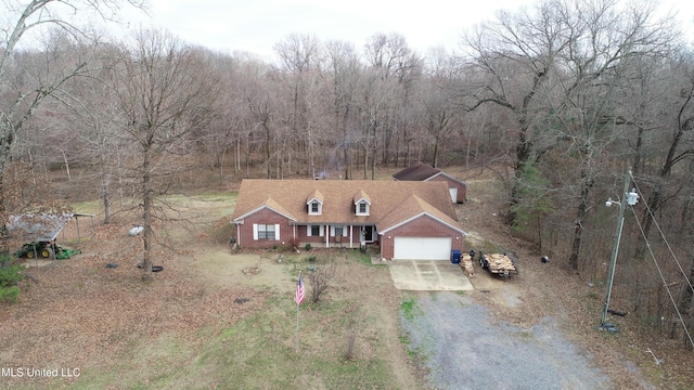 view of front of home with covered porch and a garage