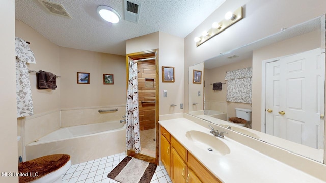 full bathroom featuring vanity, a textured ceiling, separate shower and tub, tile patterned flooring, and toilet