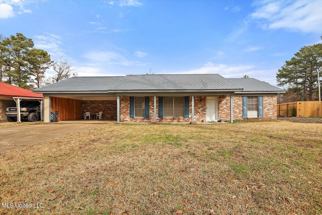 single story home featuring a carport and a front yard