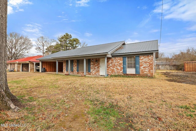 single story home with covered porch and a front yard