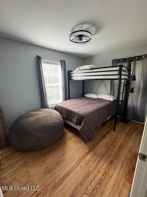 bedroom featuring wood-type flooring