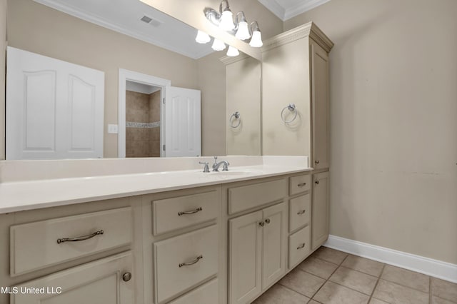 bathroom with tile patterned floors, vanity, and ornamental molding