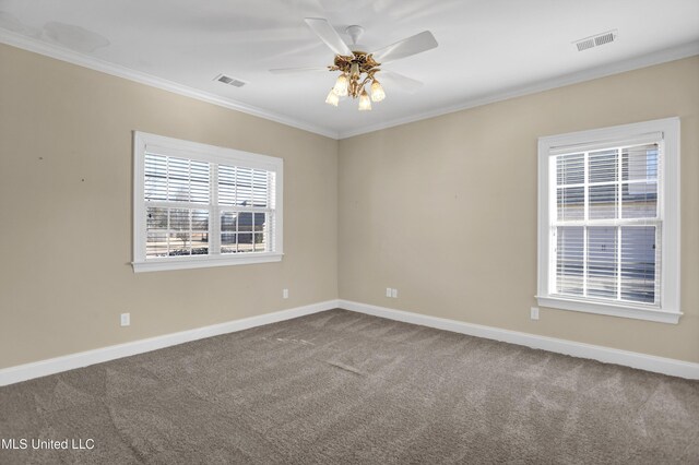 unfurnished room with ceiling fan, carpet, and crown molding