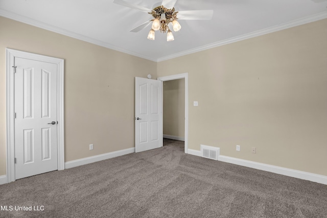 spare room featuring ceiling fan, carpet, and ornamental molding