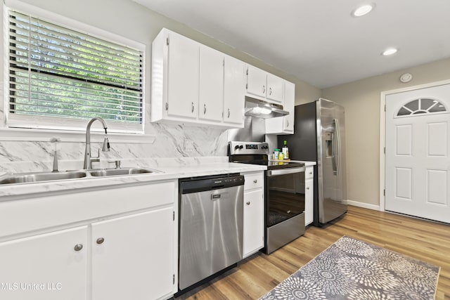 3241 Kings Bridge Rd, Moss Point, MS 39562 - kitchen featuring appliances with stainless steel finishes, under cabinet range hood, a sink, light countertops, and recessed lighting