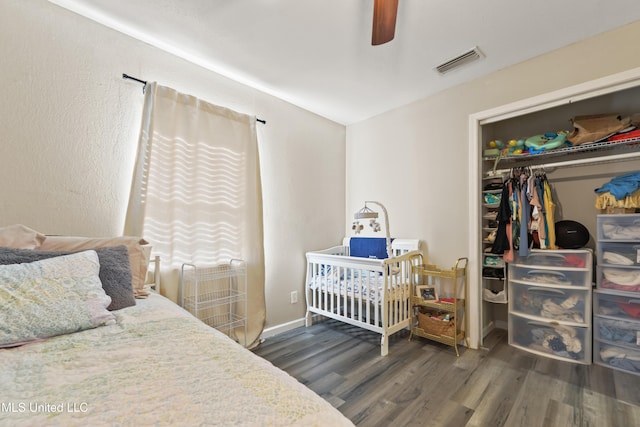 3241 Kings Bridge Rd, Moss Point, MS 39562 - bedroom with wood finished floors, a closet, a ceiling fan, and baseboards