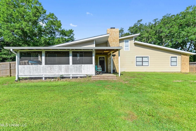 3241 Kings Bridge Rd, Moss Point, MS 39562 - rear view of house with a chimney and a sunroom