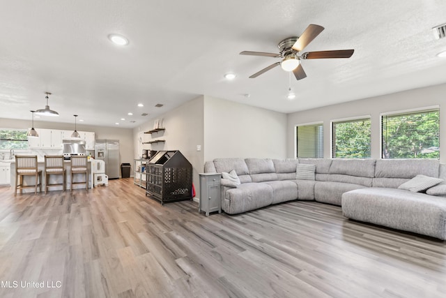 3241 Kings Bridge Rd, Moss Point, MS 39562 - living area featuring a ceiling fan, light wood-style floors, and recessed lighting