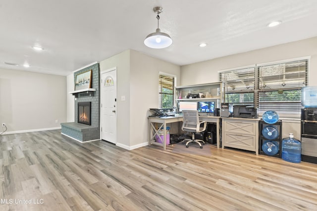 3241 Kings Bridge Rd, Moss Point, MS 39562 - home office with light wood-style floors, a brick fireplace, baseboards, and recessed lighting
