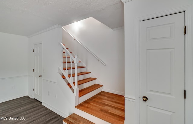 735 Wicklow Pl Unit A, Ridgeland, MS 39157 - staircase featuring wood finished floors, baseboards, a textured ceiling, and ornamental molding