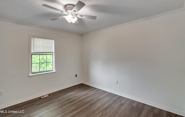 735 Wicklow Pl Unit A, Ridgeland, MS 39157 - spare room featuring crown molding, dark wood-style flooring, ceiling fan, and baseboards