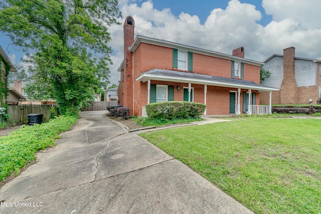 735 Wicklow Pl Unit A, Ridgeland, MS 39157 - traditional-style home featuring a chimney, brick siding, covered porch, and concrete driveway