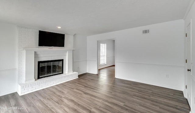 735 Wicklow Pl Unit A, Ridgeland, MS 39157 - unfurnished living room with wood finished floors, a fireplace, baseboards, and recessed lighting