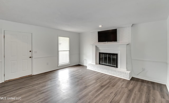 735 Wicklow Pl Unit A, Ridgeland, MS 39157 - unfurnished living room featuring a fireplace, wood finished floors, and baseboards