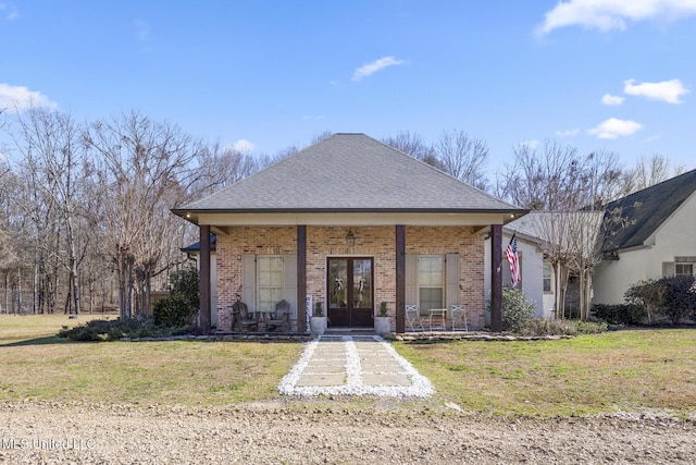 bungalow with a front yard and french doors