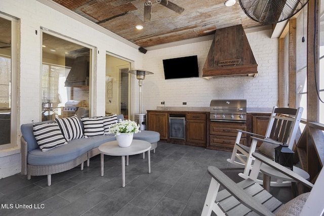 view of patio / terrace featuring ceiling fan, area for grilling, wine cooler, and grilling area