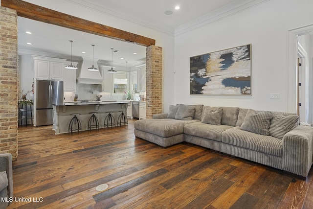 living room featuring crown molding and dark hardwood / wood-style flooring