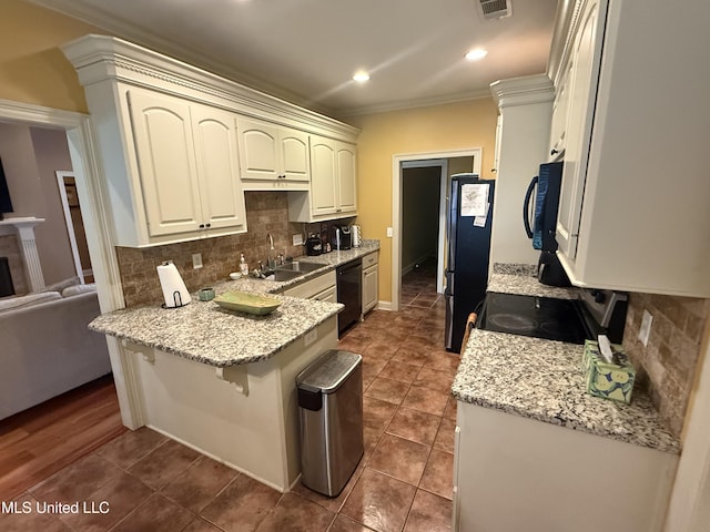 104 Belle Oak Dr, Brandon, MS 39042 - kitchen with a sink, black appliances, a peninsula, ornamental molding, and tasteful backsplash