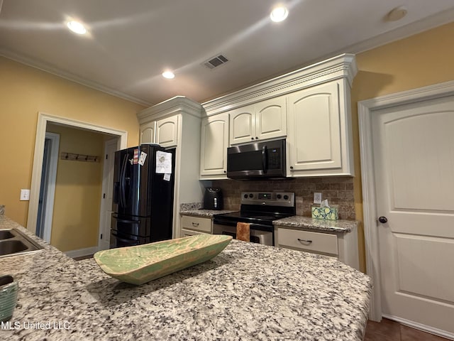 104 Belle Oak Dr, Brandon, MS 39042 - kitchen with appliances with stainless steel finishes, ornamental molding, decorative backsplash, light stone countertops, and recessed lighting
