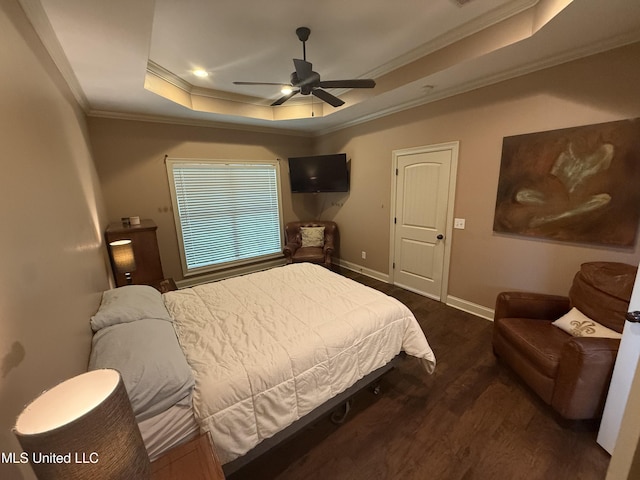 104 Belle Oak Dr, Brandon, MS 39042 - bedroom with a raised ceiling, ornamental molding, dark wood-style flooring, baseboards, and a ceiling fan