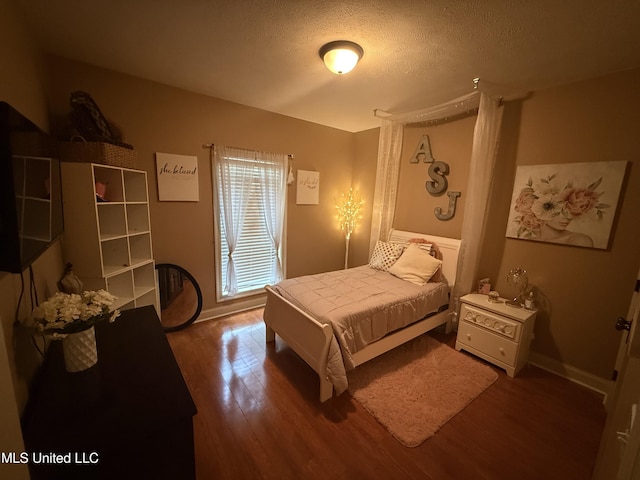 104 Belle Oak Dr, Brandon, MS 39042 - bedroom featuring wood finished floors and a textured ceiling
