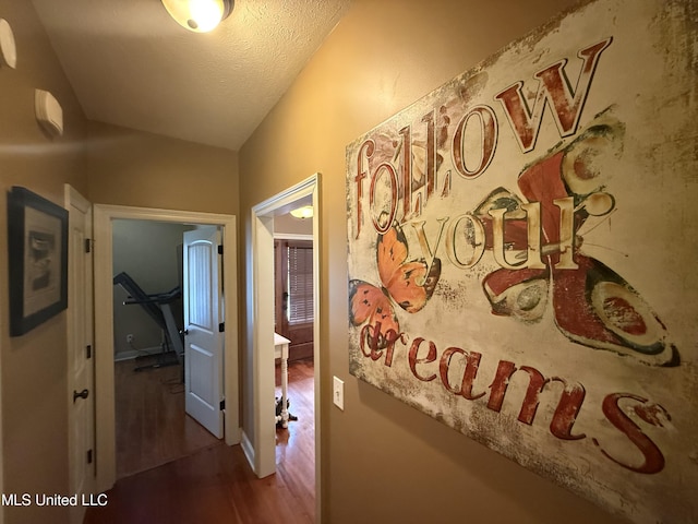 104 Belle Oak Dr, Brandon, MS 39042 - hallway featuring wood finished floors and a textured ceiling