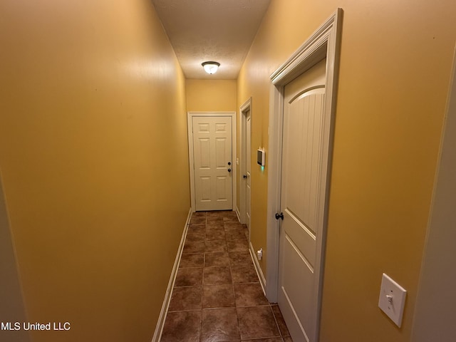104 Belle Oak Dr, Brandon, MS 39042 - corridor featuring dark tile patterned floors and baseboards