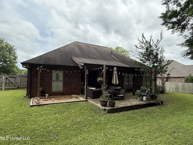 104 Belle Oak Dr, Brandon, MS 39042 - rear view of property featuring brick siding, an outdoor hangout area, a shingled roof, and a patio