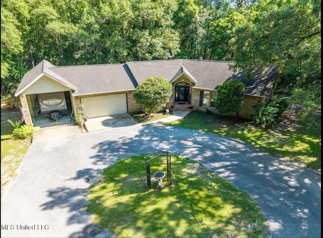 4829 Old Spanish Trl, Gautier, MS 39553 - single story home featuring asphalt driveway, a garage, a front lawn, and brick siding
